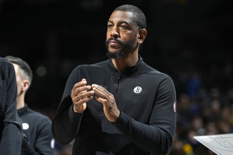 Brooklyn Nets assistant coach Kevin Ollie in the first half of an NBA basketball game Thursday, Dec. 14, 2023, in Denver. (AP Photo/David Zalubowski)