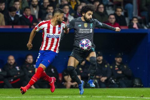 February 18, 2020, Madrid, Spain: Liverpool s FC Mohamed Salah and Atletico de Madrid s Renan Lodi are seen in action during the UEFA Champions League match, round of 16 first leg between Atletico de Madrid and Liverpool FC at Wanda Metropolitano Stadium in Madrid. Atletico de Madrid Vs Liverpool FC in Madrid, Spain - 18 Feb 2020  - ZUMAs197 20200218_zaa_s197_063 Copyright: xManuxReinox