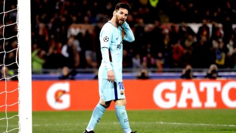 Barcelona's Lionel Messi reacts after missing a scoring chance during the Champions League quarterfinal second leg soccer match between Roma and FC Barcelona at Rome's Olympic Stadium, Tuesday, April 10, 2018. Roma won 3-0 and advances to the semifinals. (AP Photo/Andrew Medichini)