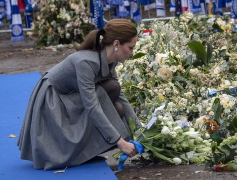 Kate, Duchess of Cambridge lays a wreath during a visit to pay tribute to those who were killed in an helicopter crash at Leicester City Football Club's King Power Stadium in Leicester, England, Wednesday, Nov. 28, 2018. Vichai Srivaddhanaprabha, the Thai billionaire owner of Premier League team Leicester City was among five people who died after his helicopter crashed and burst into flames shortly after taking off from the soccer field on Saturday Oct. 27, 2018. (Arthur Edwards/Pool via AP)