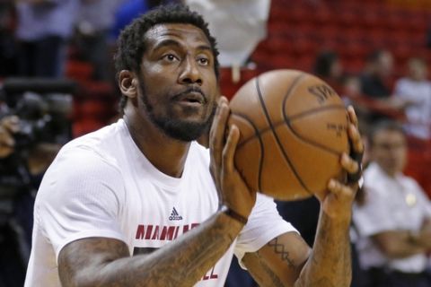 FILE - In this March 28, 2016, file photo, Miami Heat forward Amar'e Stoudemire shoots during warmups before the Heat met the Brooklyn Nets in an NBA basketball game, in Miami. After retiring from the NBA on July 26, Stoudemire signed a two-year contract Monday, Aug. 1, 2016,  to play for Israeli team Hapoel Jerusalem. Stoudemire says it was a very emotional decision for him and his family.  (AP Photo/Joe Skipper, File)
