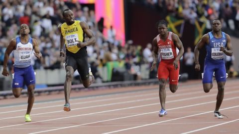 Jamaica's Usain Bolt, second left, looks across at United States' Christian Coleman, right, during a Men's 100m semifinal at the World Athletics Championships in London, Saturday, Aug. 5, 2017. (AP Photo/David J. Phillip)