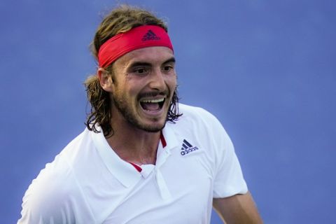 Stefanos Tsitsipas, of Greece, reacts during a match against Kevin Anderson, of South Africa, at the Western & Southern Open tennis tournament, Sunday, Aug. 23, 2020, in New York. (AP Photo/Frank Franklin II)