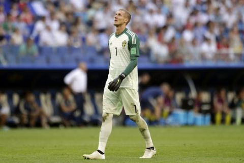Sweden goalkeeper Robin Olsen reacts during the quarterfinal match between Sweden and England at the 2018 soccer World Cup in the Samara Arena, in Samara, Russia, Saturday, July 7, 2018. (AP Photo/Matthias Schrader )