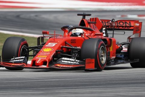 Ferrari driver Sebastian Vettel of Germany steers his car out of a curve during a qualifying session at the Barcelona Catalunya racetrack in Montmelo, just outside Barcelona, Spain, Saturday, May 11, 2019. The Spanish F1 Grand Prix race will be held on Sunday. (AP Photo/Joan Monfort)