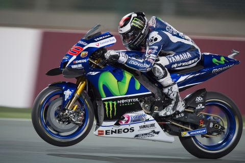 DOHA, QATAR - MARCH 18: Jorge Lorenzo of Spain and Movistar Yamaha MotoGP  lifts the front wheel during the MotoGp of Qatar - Free Practice at Losail Circuit on March 18, 2016 in Doha, Qatar.  (Photo by Mirco Lazzari gp/Getty Images)