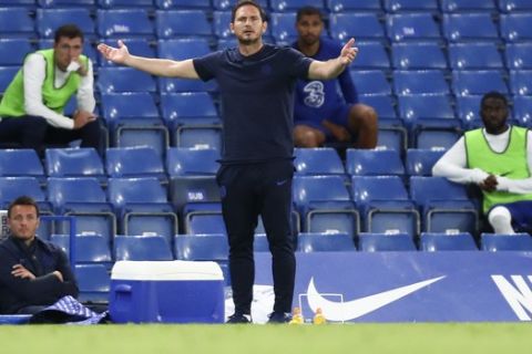 Chelsea's head coach Frank Lampard gestures during the English Premier League soccer match between Chelsea and Norwich City at Stamford Bridge in London, England, Tuesday, July 14, 2020. (AP Photo/Julian Finney,Pool)