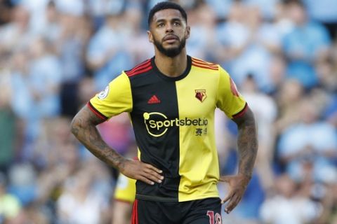 Watford's Andre Gray during the English Premier League soccer match between Manchester City and Watford at Etihad stadium in Manchester, England, Saturday, Sept. 21, 2019. (AP Photo/Rui Vieira)