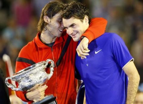  Spain's Rafael Nadal, left,  hugs Switzerland's Roger Federer during the award ceremony after winning the Men'sfinal match at the Australian Open.