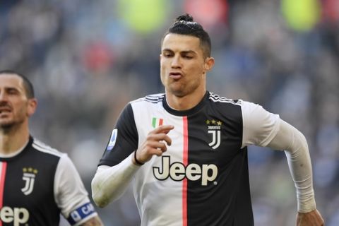 Juventus' Cristiano Ronaldo celebrates after scoring on a penalty during a Serie A soccer match between Juventus and Fiorentina, in Turin, Italy, Sunday, Feb. 2, 2020. (Fabio Ferrari/LaPresse via AP)