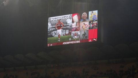A view of the screen with images in memory of devout fan Kobe Bryant, prior to the start of the Italian Cup soccer match between AC Milan and Torino, at the Milan San Siro Stadium, Italy, Tuesday, Jan. 24, 2020. Bryant, an 18-time NBA All-Star with the Los Angeles Lakers and a lifelong soccer fan, died Sunday with his 13-year-old daughter, Gianna, in a helicopter crash near Calabasas, California. He was 41. (AP Photo/Antonio Calanni)