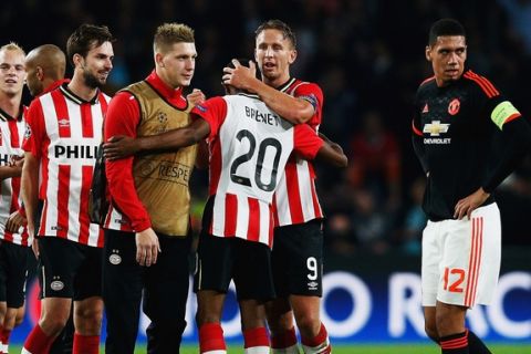 EINDHOVEN, NETHERLANDS - SEPTEMBER 15:  PSV players celebrate victory as Chris Smalling of Manchester United (12) looks dejected after the UEFA Champions League Group B match between PSV Eindhoven and Manchester United at PSV Stadion on September 15, 2015 in Eindhoven, Netherlands.  (Photo by Dean Mouhtaropoulos/Getty Images)