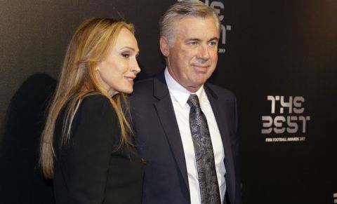 Soccer coach Carlo Ancelotti and his wife Barrena McClay arrive to attend the The Best FIFA 2017 Awards at the Palladium Theatre in London, Monday, Oct. 23, 2017. (AP Photo/Alastair Grant)