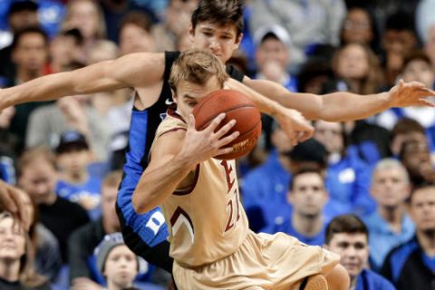 Elon's Steven Santa Ana (22) is tripped by Duke's Grayson Allen (3) in the first half of an NCAA college basketball game in Greensboro, N.C., Wednesday, Dec. 21, 2016. Allen was called for a technical foul on the play. (AP Photo/Chuck Burton)