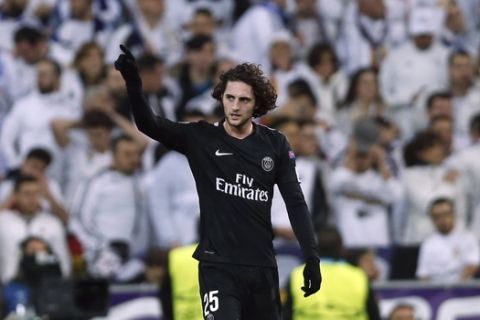 PSG's Adrien Rabiot celebrates after scoring the opening goal during a Champions League Round of 16 first leg soccer match between Real Madrid and Paris Saint Germain at the Santiago Bernabeu stadium in Madrid, Spain, Wednesday, Feb. 14, 2018. (AP Photo/Francisco Seco)
