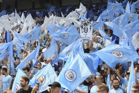 Manchester City fans cheer prior to the English Premier League soccer match between Manchester City and Huddersfield Town at Etihad stadium in Manchester, England, Sunday, May 6, 2018. (AP Photo/Rui Vieira)