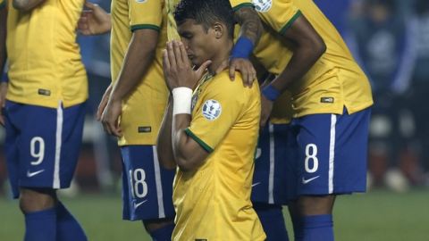 Brazil's Thiago Silva kneels on the pitch during the penalty shoot out at the end of  a Copa America quarterfinal soccer match at the Ester Roa Rebolledo Stadium in Concepcion, Chile, Saturday, June 27, 2015. Paraguay defeated Brazil 4-3 in a penalty shoot out after the game ended in a 1-1 draw. (AP Photo/Silvia Izquierdo)