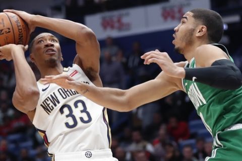 New Orleans Pelicans forward Wesley Johnson (33) shoots against Boston Celtics forward Jayson Tatum in the first half of an NBA basketball game in New Orleans, Monday, Nov. 26, 2018. (AP Photo/Gerald Herbert)