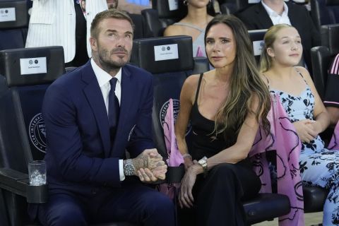 Inter Miami co-owner David Beckham and his wife Victoria wait for a Leagues Cup soccer match to start against Cruz Azul, Friday, July 21, 2023, in Fort Lauderdale, Fla. (AP Photo/Lynne Sladky)
