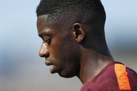 Barcelona's Ousmane Dembele leaves the pitch injured during a Spanish La Liga soccer match between Getafe and Barcelona at the Alfonso Perez stadium in Getafe, outside Madrid, Saturday, Sept. 16, 2017. Barcelona won 2-1. (AP Photo/Francisco Seco)