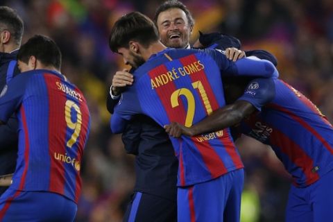 Barcelona's head coach Luis Enrique celebrates with some of his players at the end of the Champions League round of 16, second leg soccer match between FC Barcelona and Paris Saint Germain at the Camp Nou stadium in Barcelona, Spain, Wednesday March 8, 2017. Barcelona won the match 6-1 (6-5 on aggregate). (AP Photo/Manu Fernandez)