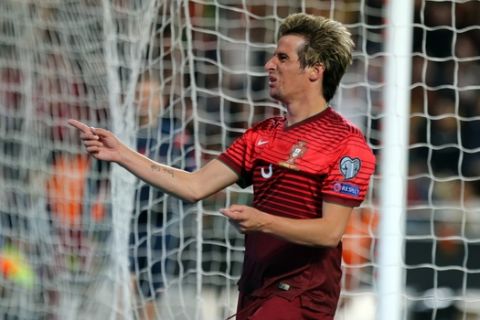 Portugal's Fabio Coentrao celebrates after scoring his side's second goal against Serbia during the Euro 2016 group I qualifying soccer match between Portugal and Serbia at the Luz stadium, in Lisbon, Portugal, Sunday, March 29, 2015. (AP Photo/Francisco Seco)