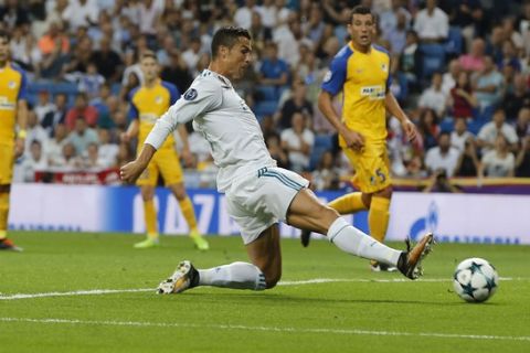 Real Madrid's Cristiano Ronaldo reaches for the ball during a Champions League group H soccer match between Real Madrid and Apoel Nicosia at the Santiago Bernabeu stadium in Madrid, Spain, Wednesday, Sept. 13, 2017. (AP Photo/Paul White)