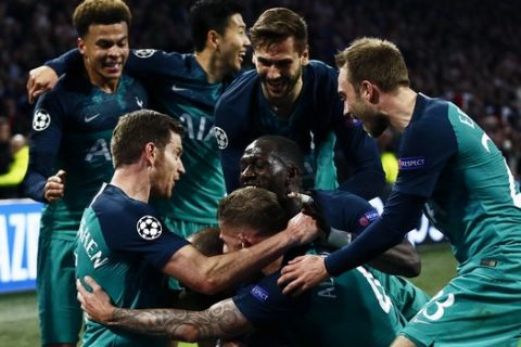 Tottenham players celebrate after scoring their third goal during the Champions League semifinal second leg soccer match between Ajax and Tottenham Hotspur at the Johan Cruyff ArenA in Amsterdam, Netherlands, Wednesday, May 8, 2019. (AP Photo/Peter Dejong)