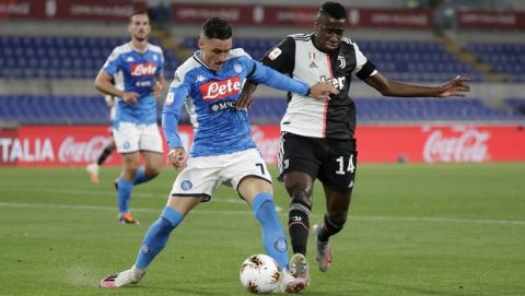 Juventus' Blaise Matuidi, right, challenges for the ball with Napoli's Jose Callejon during the Italian Cup soccer final match between Napoli and Juventus, at Rome's Olympic Stadium, Wednesday, June 17, 2020. (AP Photo/Andrew Medichini)