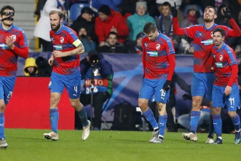 Plzen's Tomas Chory, second from right, celebrates with his teammates after scoring his side's second goal during the Champions League group G soccer match between Viktoria Plzen and Roma at the Doosan arena in Pilsen, Czech Republic, Wednesday, Dec. 12, 2018. (AP Photo/Petr David Josek)