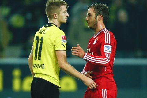 Borussia Dortmund's Marco Reus (L) and Bayern Munich's Mario Goetze chat after their German first division Bundesliga soccer match in Dortmund, November 23,  2013.                          REUTERS/Ina Fassbender (GERMANY  - Tags: SPORT SOCCER) DFL RULES TO LIMIT THE ONLINE USAGE DURING MATCH TIME TO 15 PICTURES PER GAME. IMAGE SEQUENCES TO SIMULATE VIDEO IS NOT ALLOWED AT ANY TIME. FOR FURTHER QUERIES PLEASE CONTACT DFL DIRECTLY AT + 49 69 650050.   - RTX15Q8B