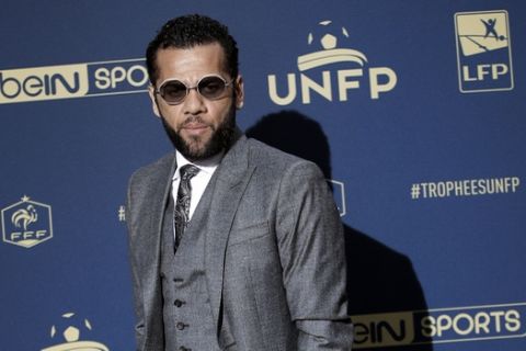 PSG's Dani Alves poses as he arrives at the UNFP (Union of French Professional Footballers) ceremony, in Paris, Sunday, May 13, 2018. (AP Photo/Christophe Ena)