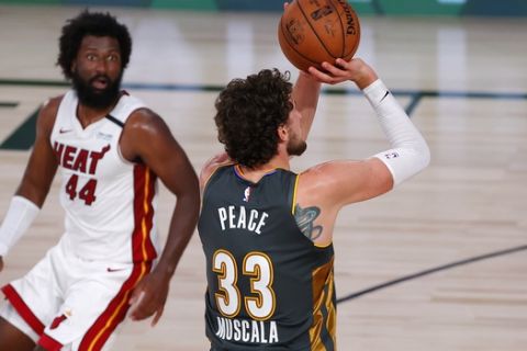 Oklahoma City Thunder's Mike Muscala (33) shoots the go-ahead 3-point basket next to Miami Heat's Solomon Hill during the fourth quarter of an NBA basketball game Wednesday, Aug. 12, 2020, in Lake Buena Vista, Fla. (Kevin C. Cox/Pool Photo via AP)