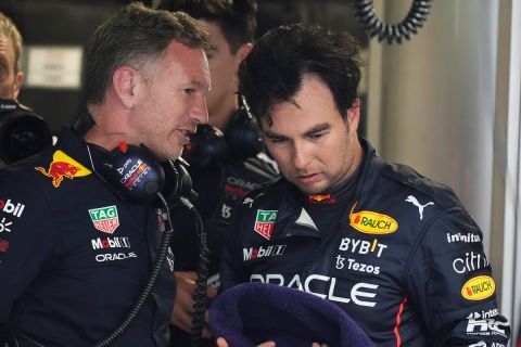 Red Bull Racing principal Christian Horner speaks with Red Bull driver Sergio Perez of Mexico following the third practice session for the Formula One Miami Grand Prix auto race at the Miami International Autodrome, Saturday, May 7, 2022, in Miami Gardens, Fla. (AP Photo/Darron Cummings)