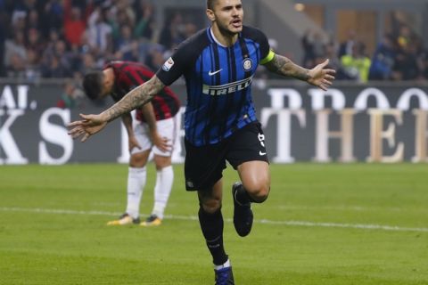 Inter Milan's Mauro Icardi celebrates after scoring during the Serie A soccer match between Inter Milan and AC Milan, at the Milan San Siro Stadium, Italy, Sunday, Oct. 15, 2017. (AP Photo/Antonio Calanni)