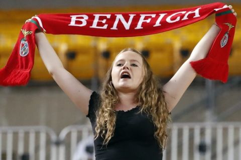 A fan of the Benfica soccer team cheers during Benfica's International Champions Cup tournament soccer match against Borussia Dortmund in Pittsburgh, Wednesday, July 25, 2018. (AP Photo/Gene J. Puskar)