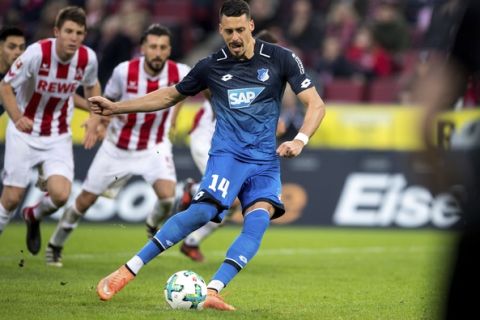 Hoffenheim's Sandro Wagner uses the penalty kick to score the 2-0 goal during the German Bundesliga soccer match between 1. FC Cologne and 1899 Hoffenheim in Cologne, Germany,  Sunday, Nov. 5, 2017.  (Marius Becker/dpa via AP)