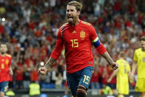 Spain's Sergio Ramos celebrates after scoring the opening goal with a penalty during the Euro 2020 Group F qualifying soccer match between Spain and Sweden at the Santiago Bernabeu stadium in Madrid, Monday June 10, 2019. (AP Photo/Manu Fernandez)