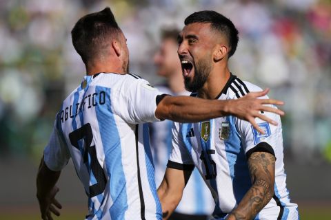 Argentina's Nicolas Tagliafico, left, celebrates with teammate Nicolas Gonzalez after scoring his side's second goal against Bolivia during a qualifying soccer match for the FIFA World Cup 2026 at the Hernando Siles stadium in La Paz, Bolivia, Tuesday, Sept. 12, 2023. (AP Photo/Juan Karita)