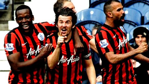 QPR's captain Joey Barton, center, celebrates with team mates after scoring against West Brom during the English Premier League soccer match between West Bromwich Albion and Queens Park Rangers at the Hawthorns, West Bromwich, England, Saturday, April 4, 2015. (AP Photo/Rui Vieira)