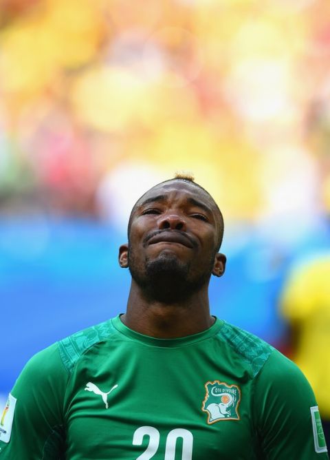 BRASILIA, BRAZIL - JUNE 19: Die Serey of the Ivory Coast gets emotional during his National Anthem during the 2014 FIFA World Cup Brazil Group C match between Colombia and Cote D'Ivoire at Estadio Nacional on June 19, 2014 in Brasilia, Brazil.  (Photo by Christopher Lee/Getty Images)