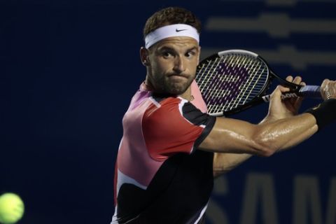 Bulgaria's Grigor Dimitrov prepares to hit a backhand to Switzerland's Stan Wawrinka in the quarterfinals of the Mexican Open tennis tournament in Acapulco, Mexico, Thursday, Feb. 27, 2020. (AP Photo/Rebecca Blackwell)