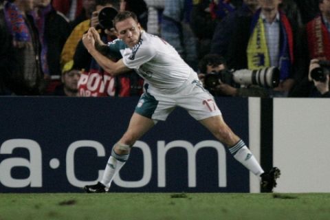 Liverpools's Craig Bellamy celebrates scoring a goal against  Barcelona by pretending to swing a golf club in the Champions League first knockout round, first-leg soccer match. at the Camp Nou Stadium, Barcelona, Spain, Wednesday Feb. 21, 2007.  The gesture appears to be a reference to claims  that Bellamy allegedly hit  team mate John Arne Riise in the legs with a golf club in a fracas while Liverpool was in Portugal at a training camp preparing for a Champions League match against defending champion FC Barcelona.  Bellamy now faces a fine of 80,000 pounds (US$155,000; 118,000) and an uncertain future with the 18-time English league champions, who were recently taken over by a pair of American businessmen.  (AP Photo/Dave Thompson)