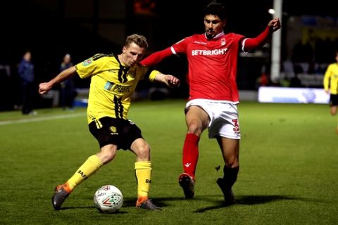 Nottingham Forest's Gil Dias, right and Burton Albion's Jamie Allen battle for the ball, during  the fourth round Football League Cup soccer match between Burton Albion and Nottingham Forest,  at the Pirelli Stadium, in Burton, England, Tuesday, Oct. 30, 2018. (Nigel French/PA via AP)