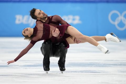 Gabriella Papadakis and Guillaume Cizeron, of France, perform their routine in the ice dance competition during figure skating at the 2022 Winter Olympics, Saturday, Feb. 12, 2022, in Beijing. (AP Photo/Natacha Pisarenko)