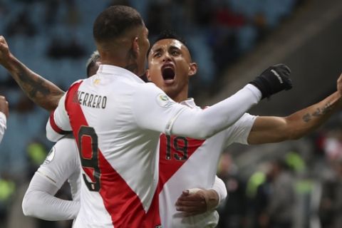 Peru's Victor Yotun, right, celebrates scoring his side's second goal with teammate Paolo Guerrero during a Copa America semifinal soccer match against Chile at the Arena do Gremio in Porto Alegre, Brazil, Wednesday, July 3, 2019. (AP Photo/Ricardo Mazalan)