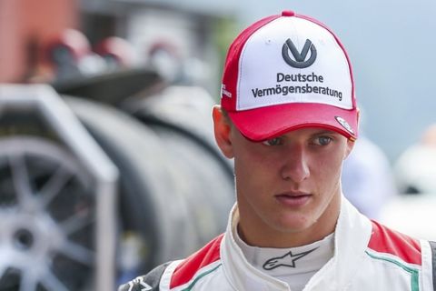 Mick Schumacher, son of seven-time F1 world champion Michael Schumacher, prepares to drive an exhibition lap ahead of the Belgian Formula One Grand Prix in Spa-Francorchamps, Belgium, Sunday, Aug. 27, 2017. Mick Schumacher marked the 25th anniversary of his father's maiden Grand Prix victory by demonstrating one of his championship-winning cars ahead of Sunday's race in Belgium. (Stephanie Lecocq, Pool photo via AP)