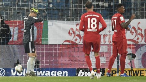 Bayern's goalkeeper Manuel Neuer is dejected after Alphonso Davies scored an own goal during the German soccer cup, DFB Pokal, second round match between VfL Bochum and Bayern Munich at the Vonovia Ruhrstadion stadium, in Bochum, Germany, Tuesday, Oct. 29, 2019. (AP Photo/Martin Meissner)