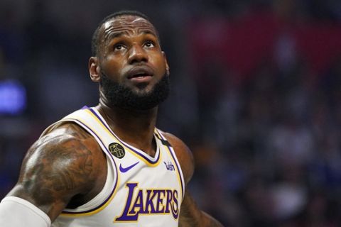 Los Angeles Lakers forward LeBron James watches for a rebound during the first half of an NBA basketball game against the Los Angeles Clippers Sunday, March 8, 2020, in Los Angeles. (AP Photo/Mark J. Terrill)