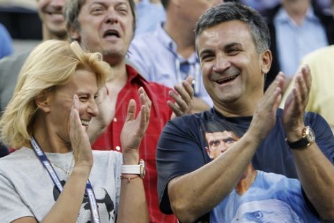 Srdan and Diana Djokovic, patents of Novak Djokovic, react after Novak defeated Roger Federer, of Switzerland, in five sets in a men's semifinal match at the U.S. Open tennis tournament in New York, Saturday, Sept. 11, 2010. (AP Photo/Mark Humphrey)